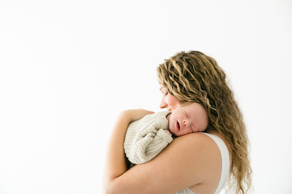 mother with newborn after hospital birth - what to pack in hospital bag