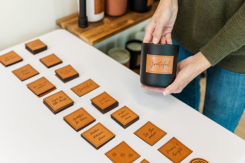 Detail shot of the custom leather candle label from Pelican Place & Company