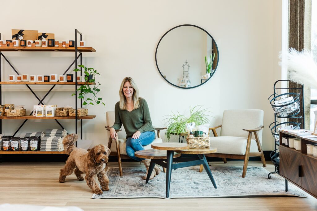 A woman smiling while seated for a professional headshot.