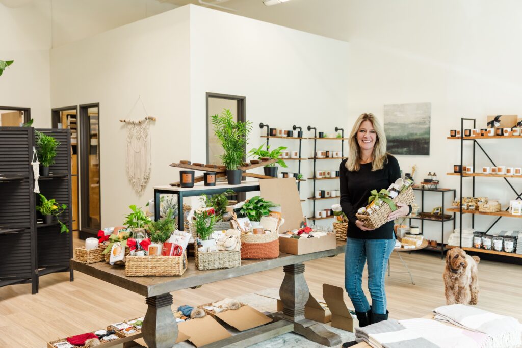 Pelican Place & Company Founder carrying a their thoughtful Gift Baskets
