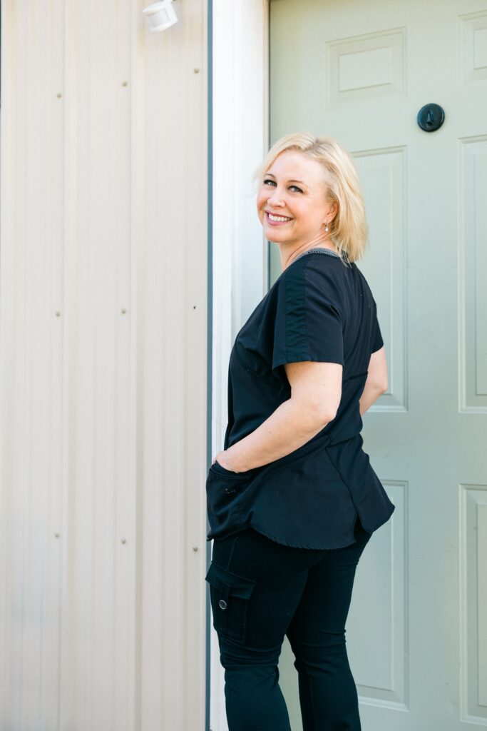 Branding portrait of Sage & Honey Spa founder at the spa entrance