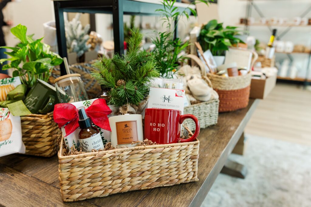Gift basket featuring candles and artisan items.