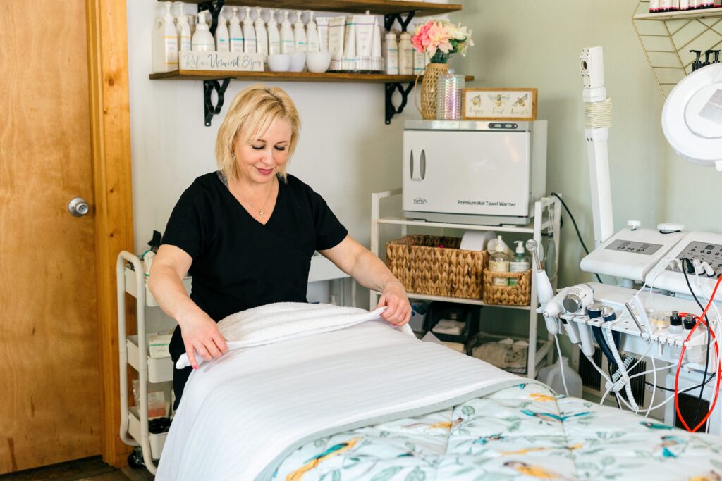 Owner of Sage & Honey Spa photographed in action while working