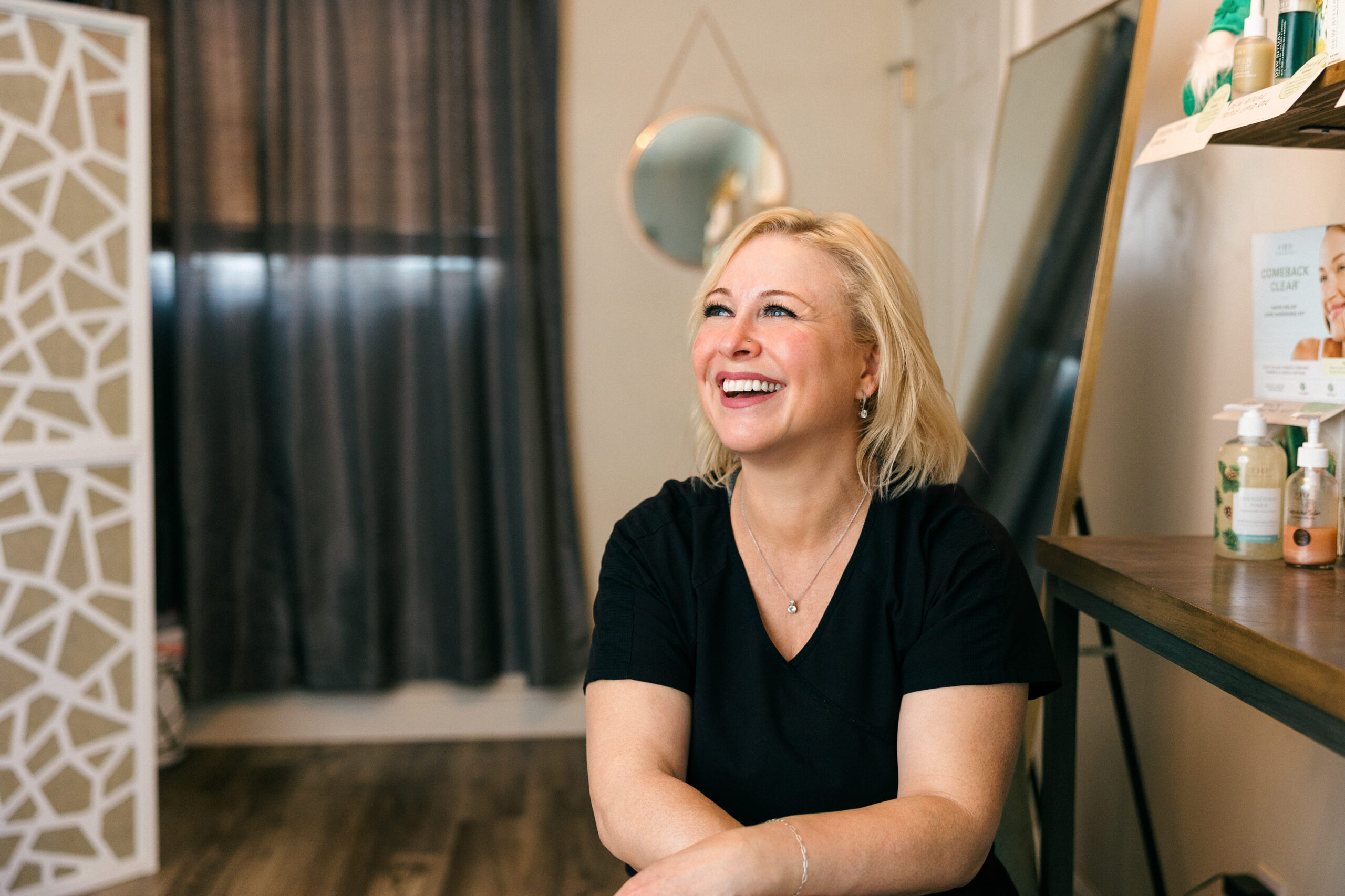 Branding portrait of Sage & Honey Spa owner smiling at the camera