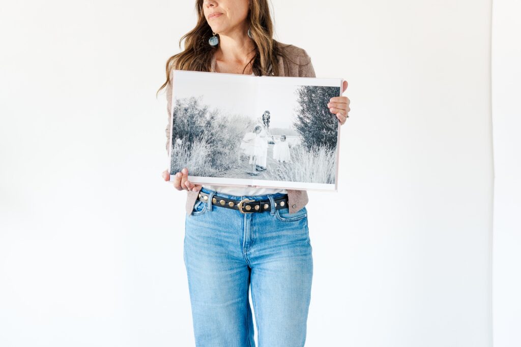 Heirloom album from Amara’s motherhood session featuring soft, timeless portraits of a mother and her daughters