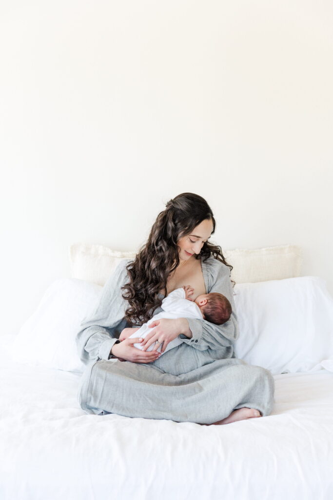 Mother breastfeeding her baby during a quiet photography session