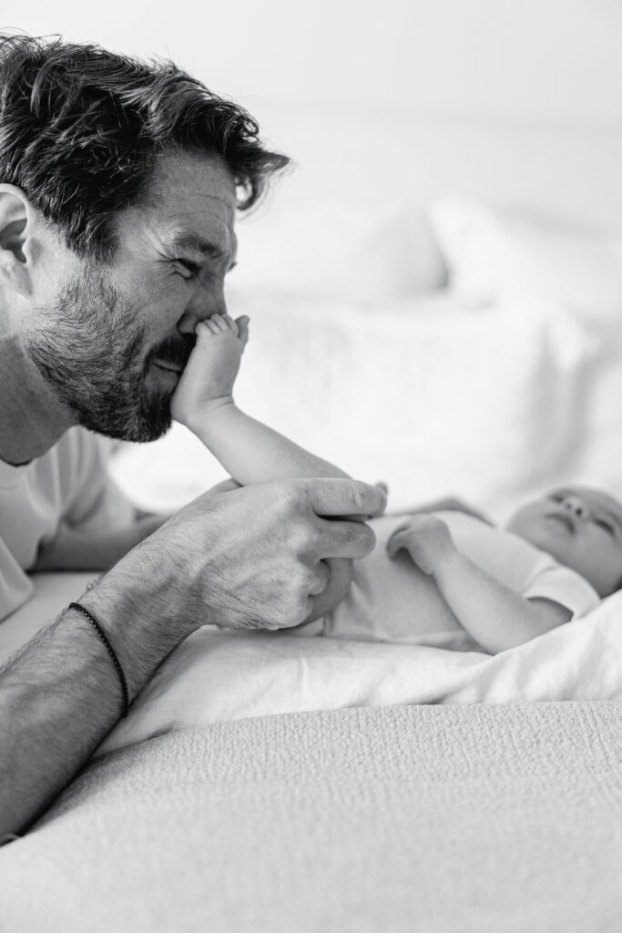 Dad comforting her baby during a quiet moment in their home.