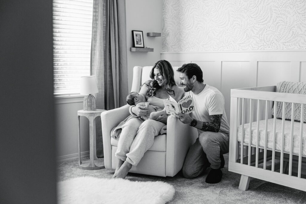 Parents sharing a tender moment with their newborn in their home.