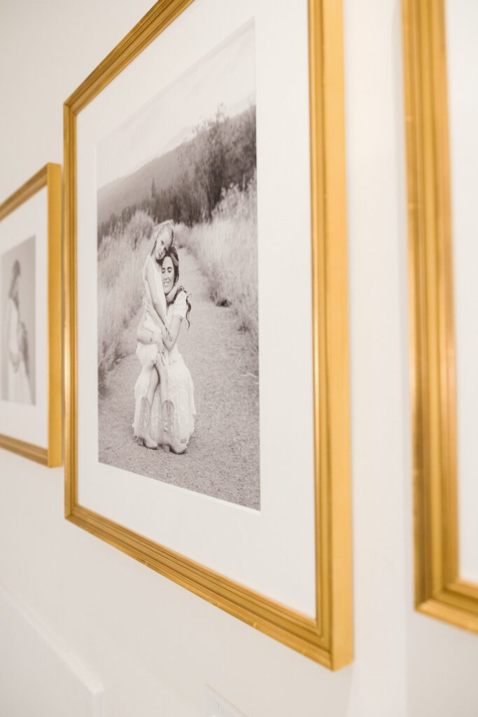 Detail of gold frame and museum quality print on a custom gallery wall in Bend, Oregon home
