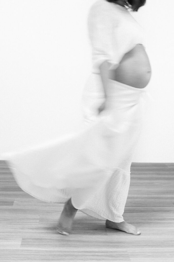 black and white maternity portrait of an expecting mother